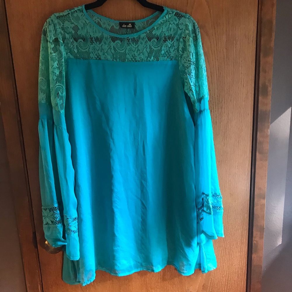Lace, flowy, mini blue dress.